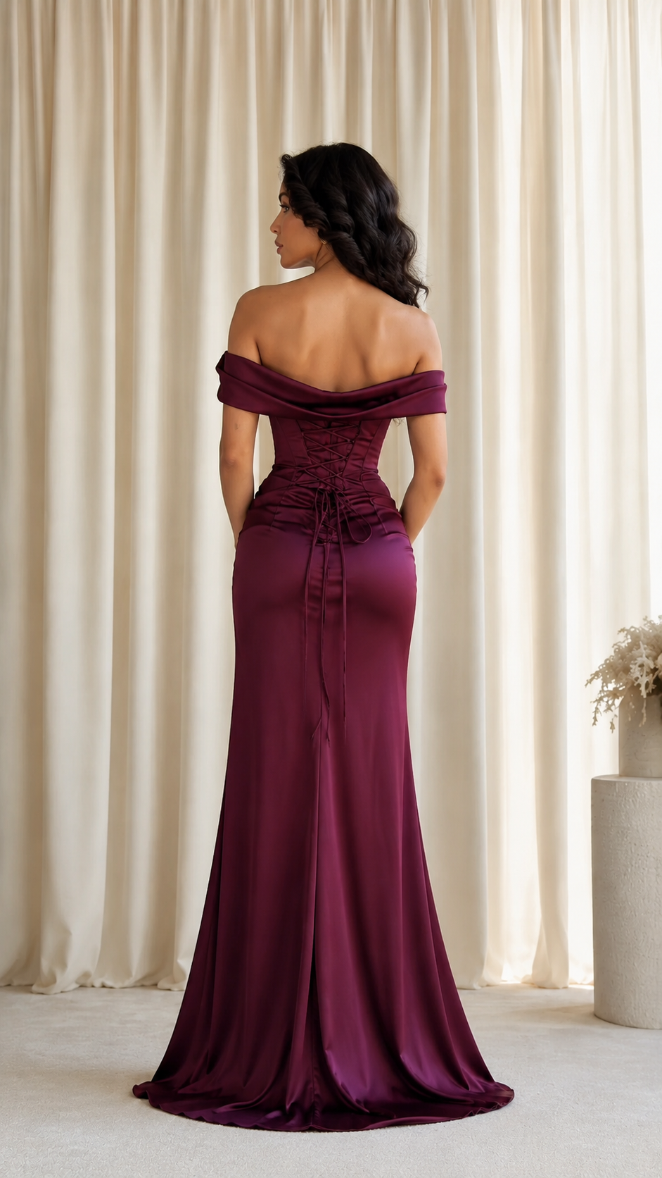 Back view of the wine off-shoulder maxi gown with lace-up inspired back detailing