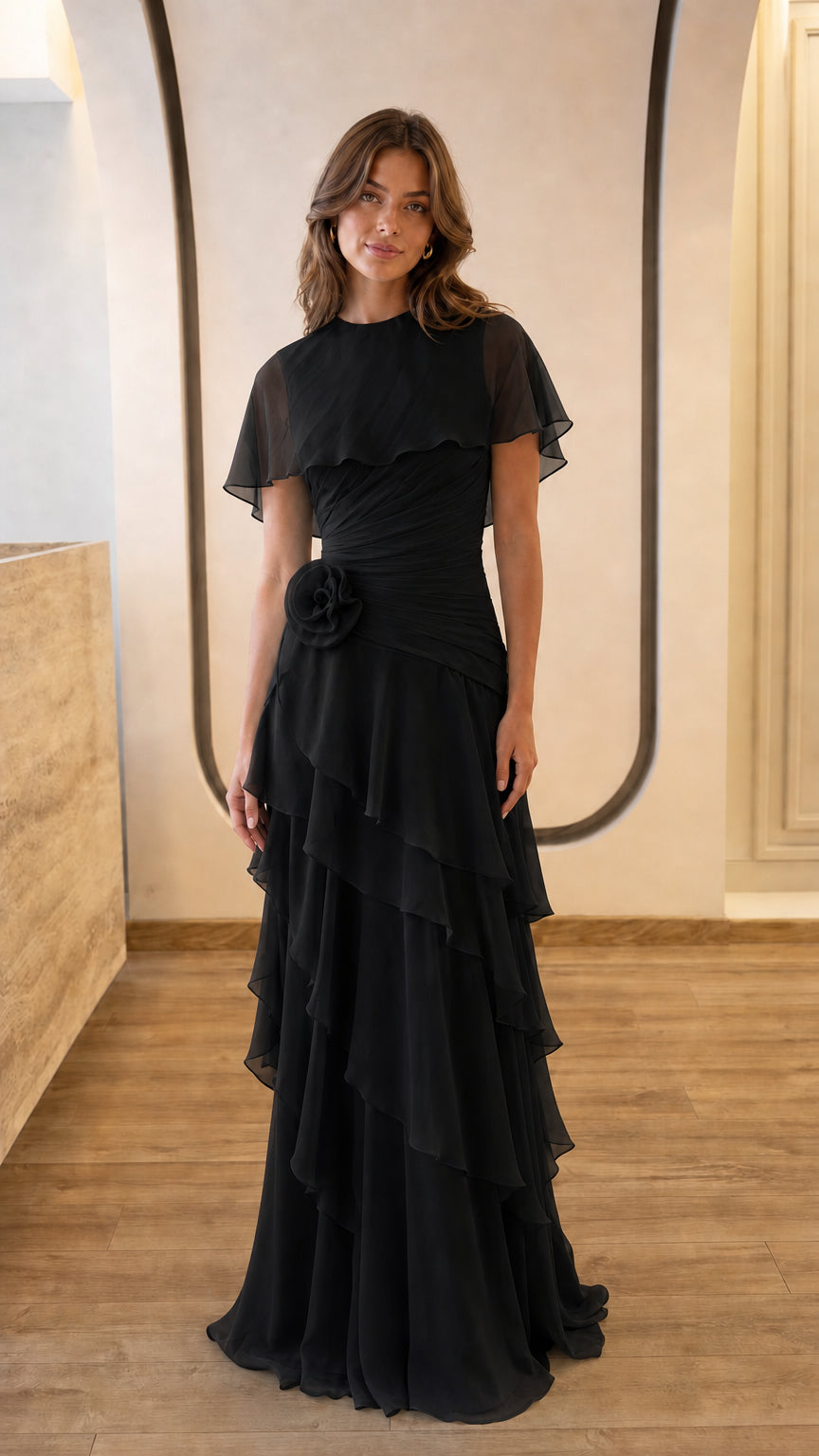 Full view of black chiffon capelet evening gown