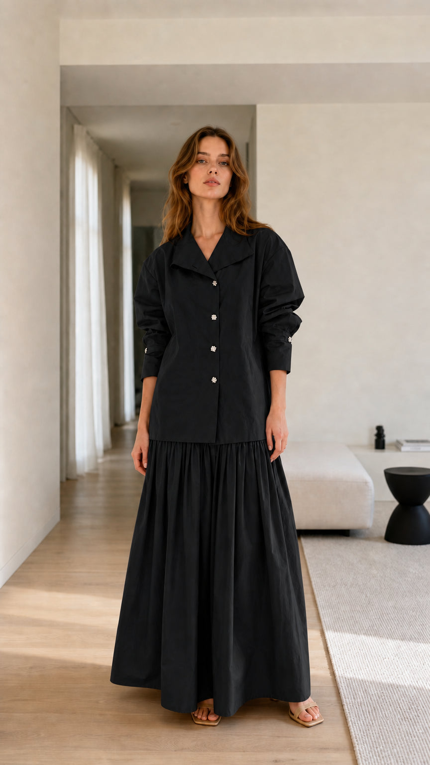 Model wearing black two-piece set