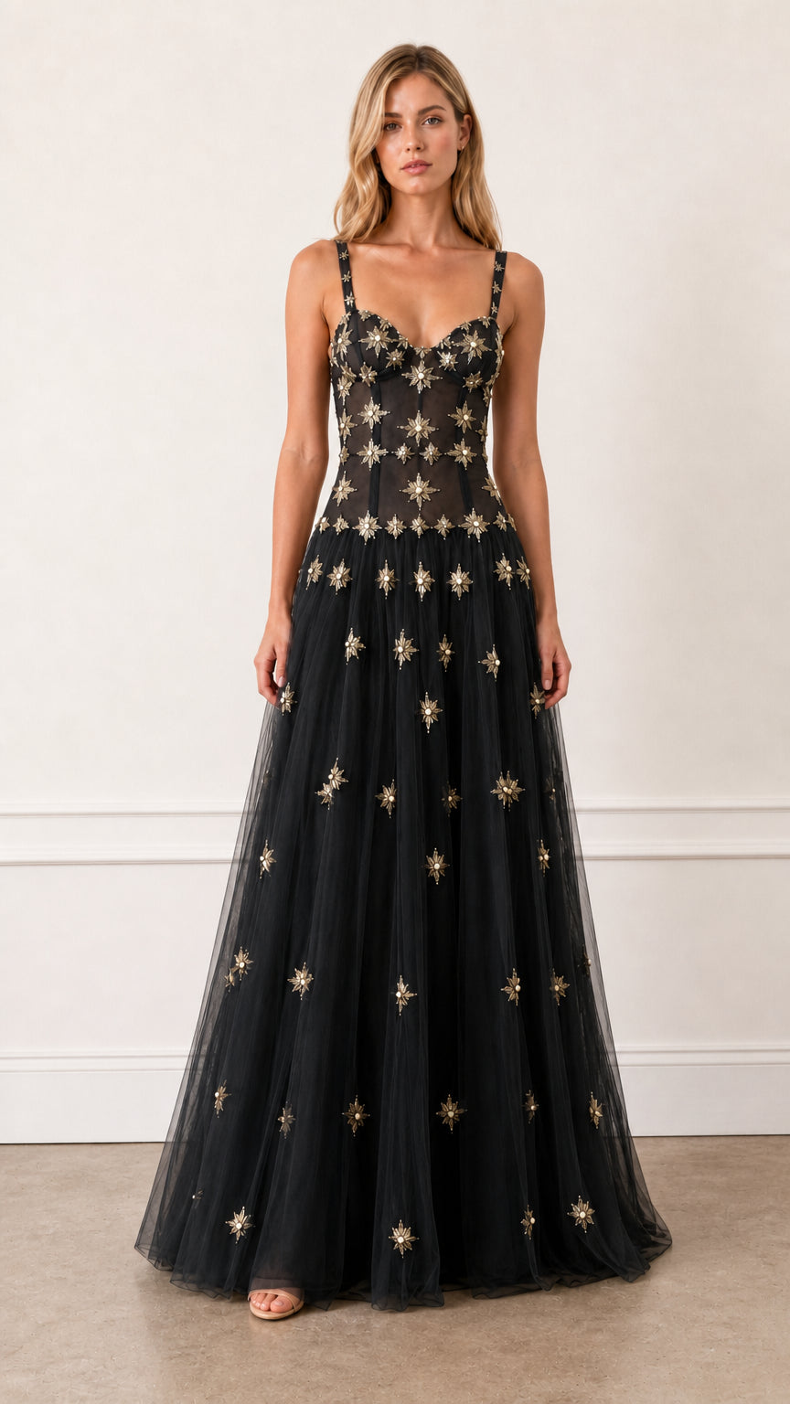 Front view of Black embroidered starburst tulle evening gown