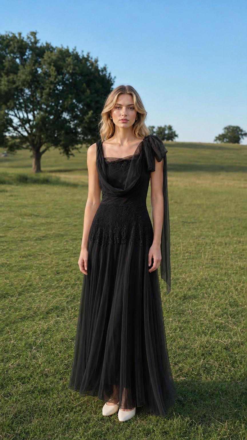 Front view of model wearing black tulle maxi dress