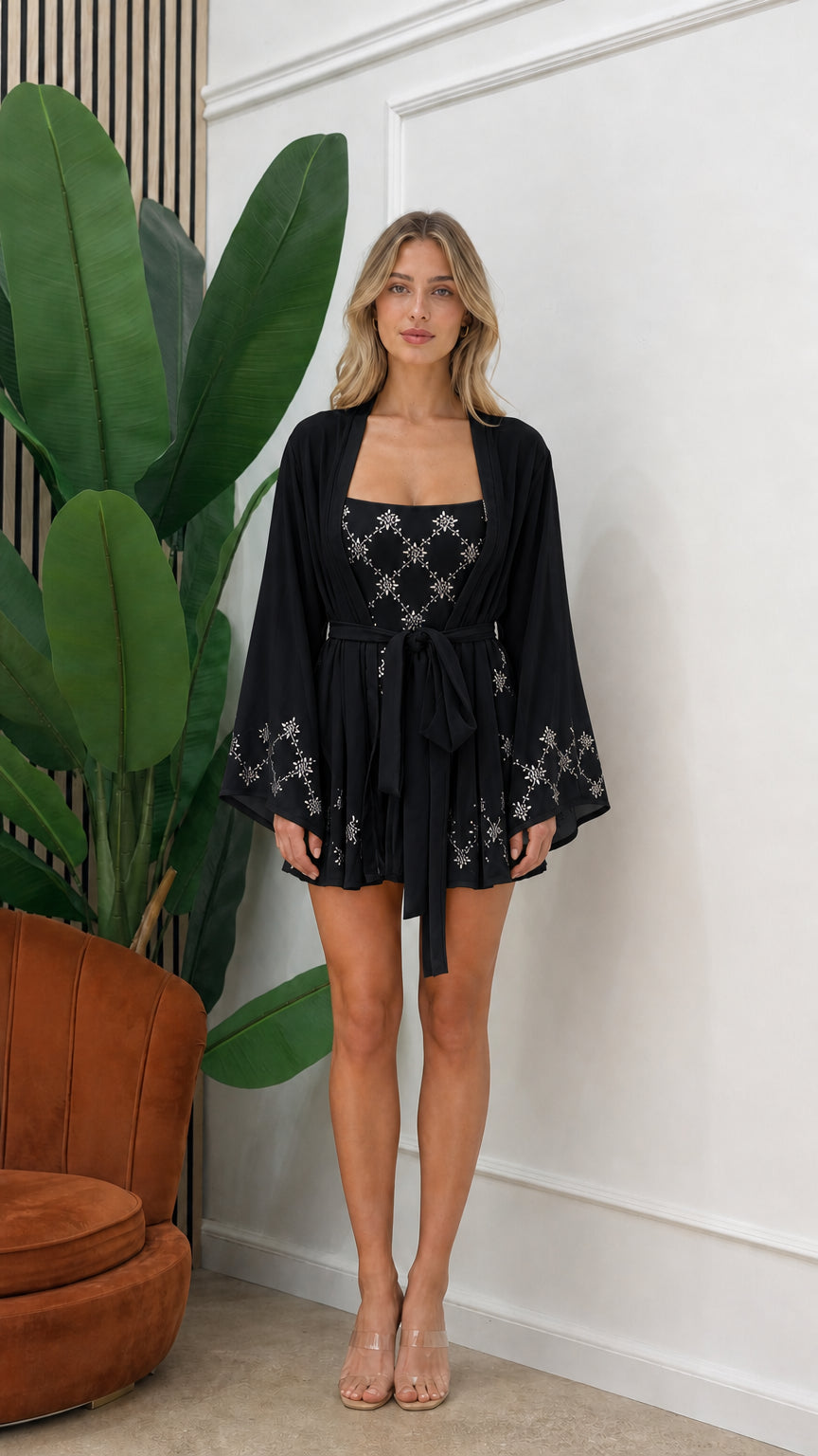 Front view of model wearing black embellished three-piece kimono set