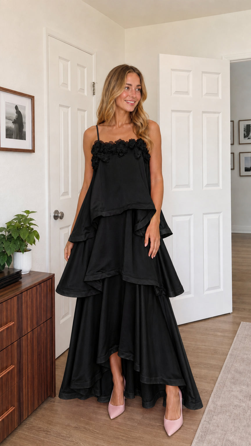 Front view of model wearing black tiered ruffle cami maxi dress