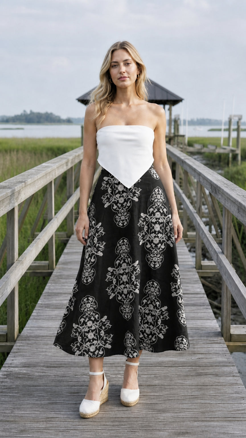 Front view of black floral midi skirt variant
