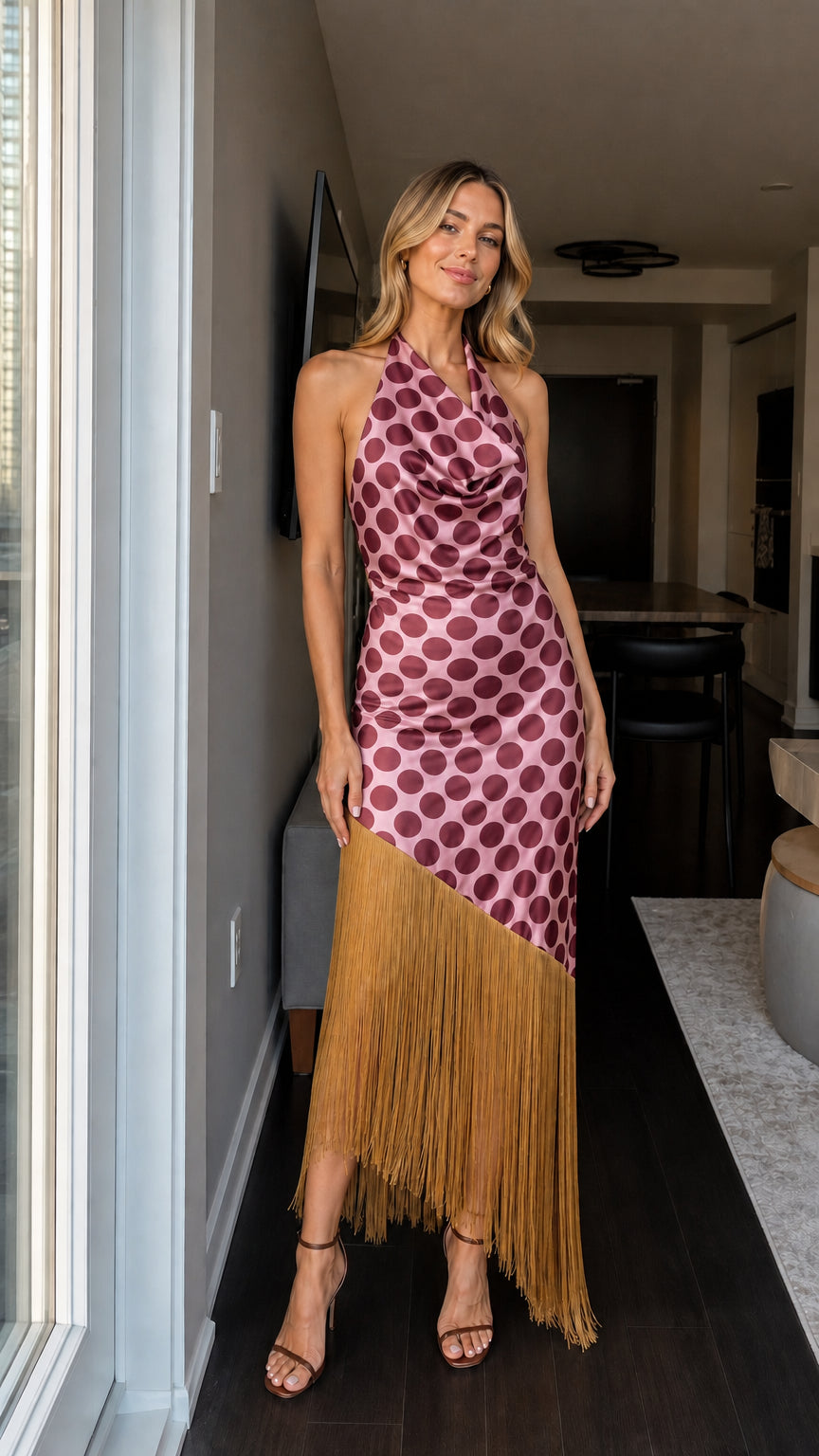 Woman wearing pink and tan polka dot fringe maxi dress