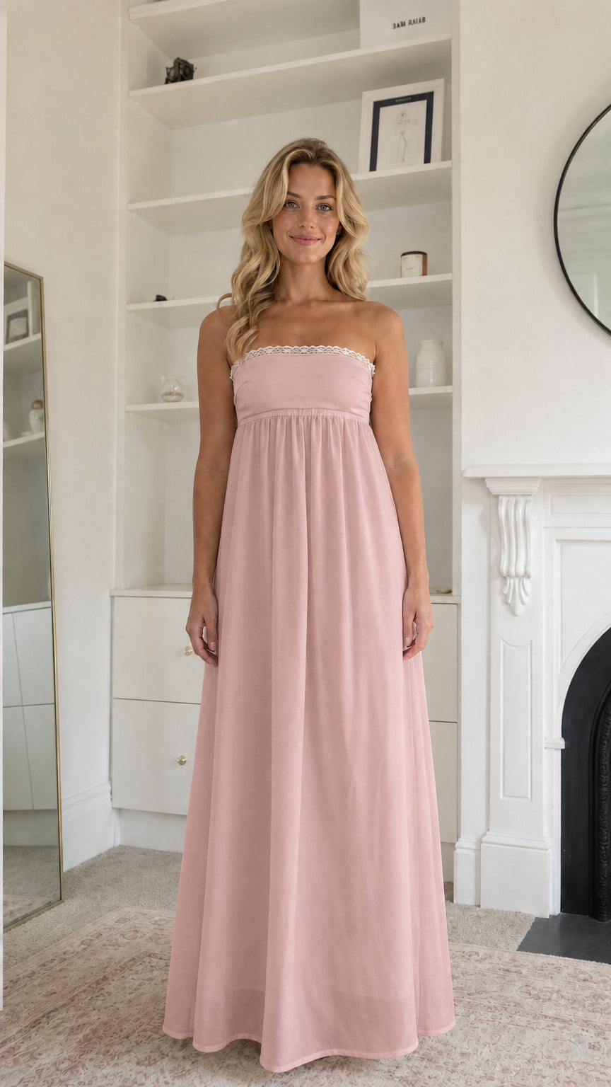 Woman wearing blush pink strapless maxi dress