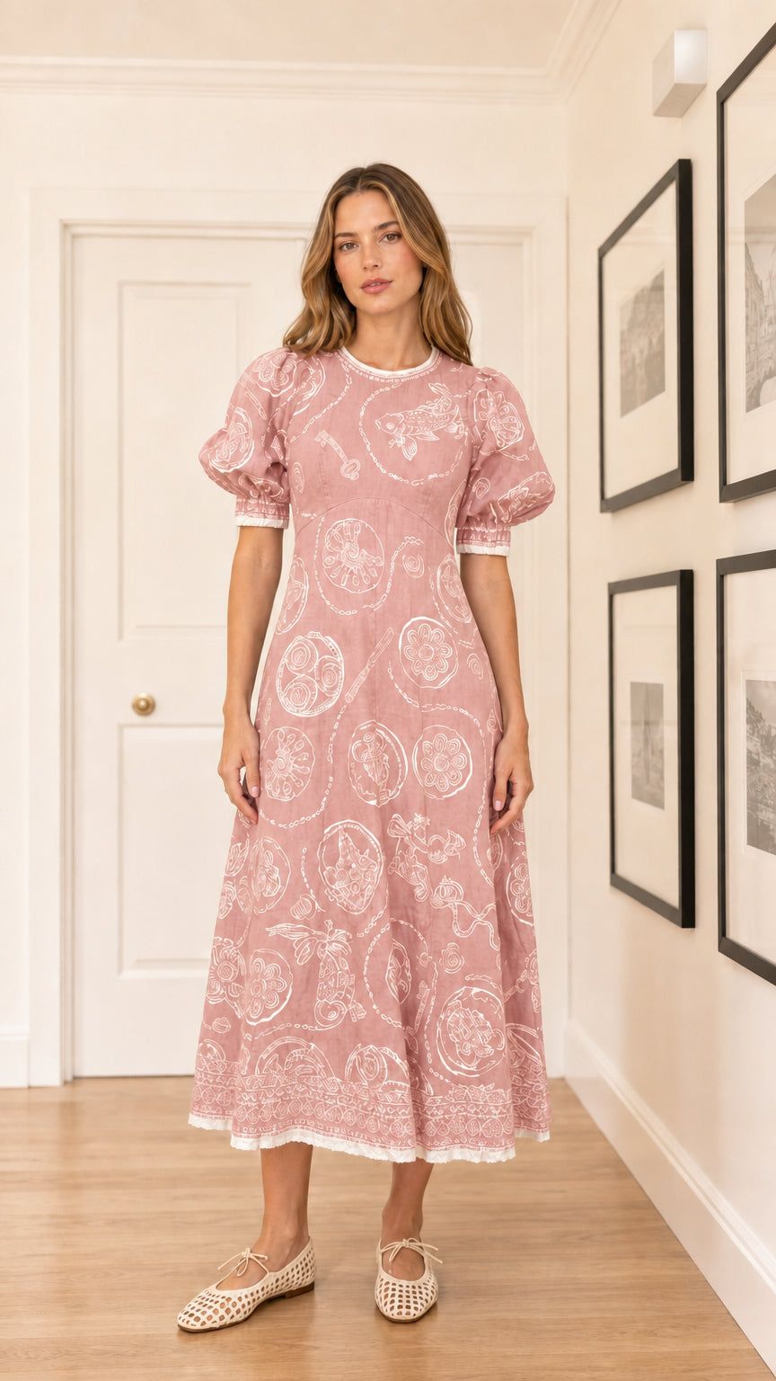 Woman wearing pink embroidered puff sleeve midi dress