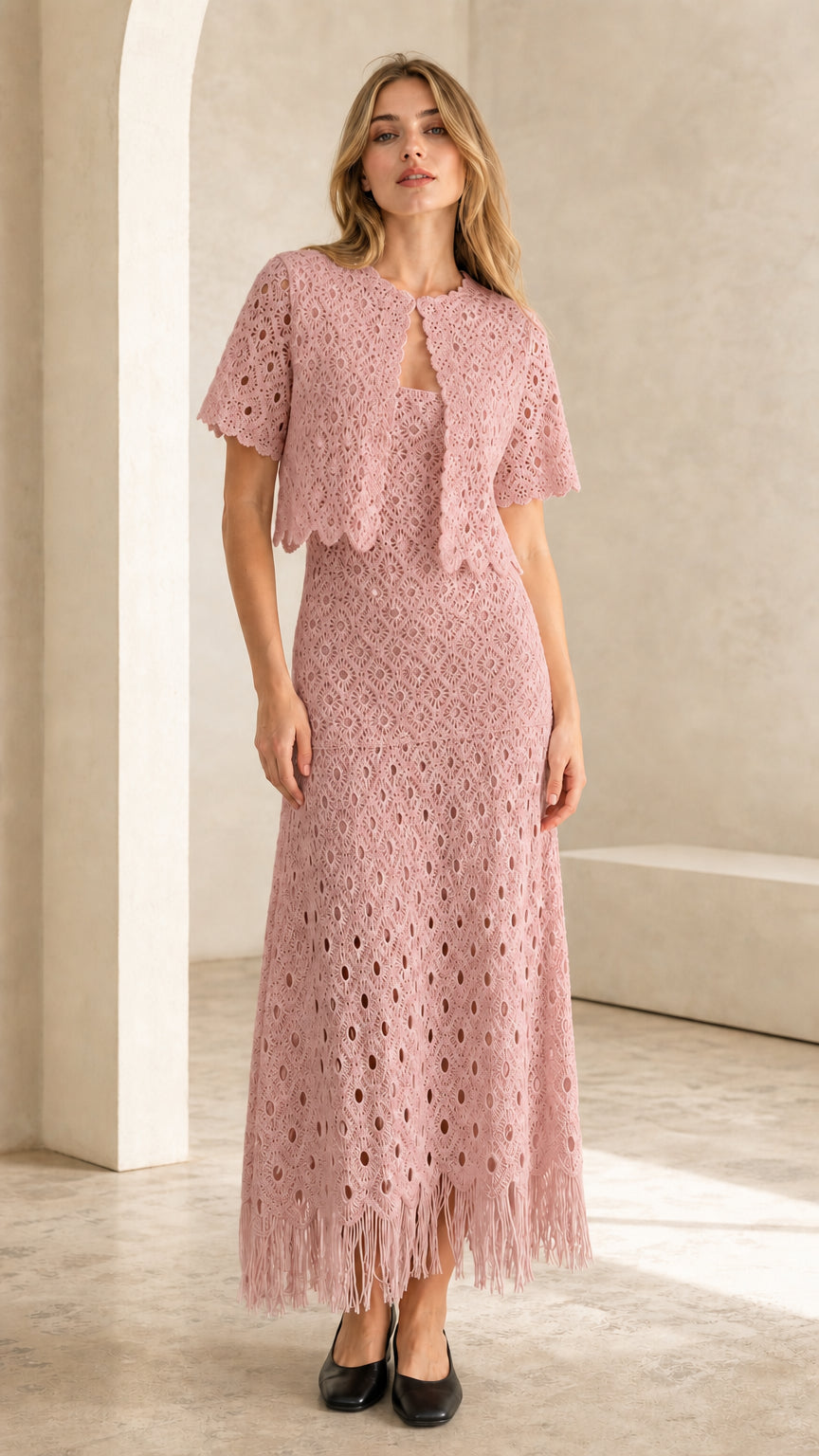 Front view of pink crochet lace two-piece set on model