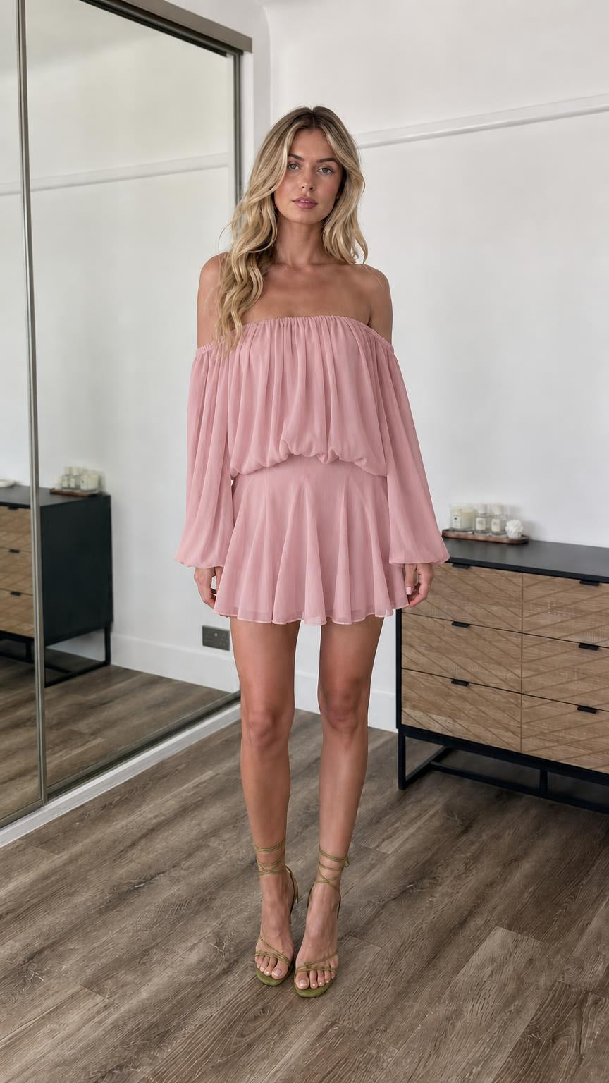 Front view of model wearing dusty pink off-the-shoulder mini dress