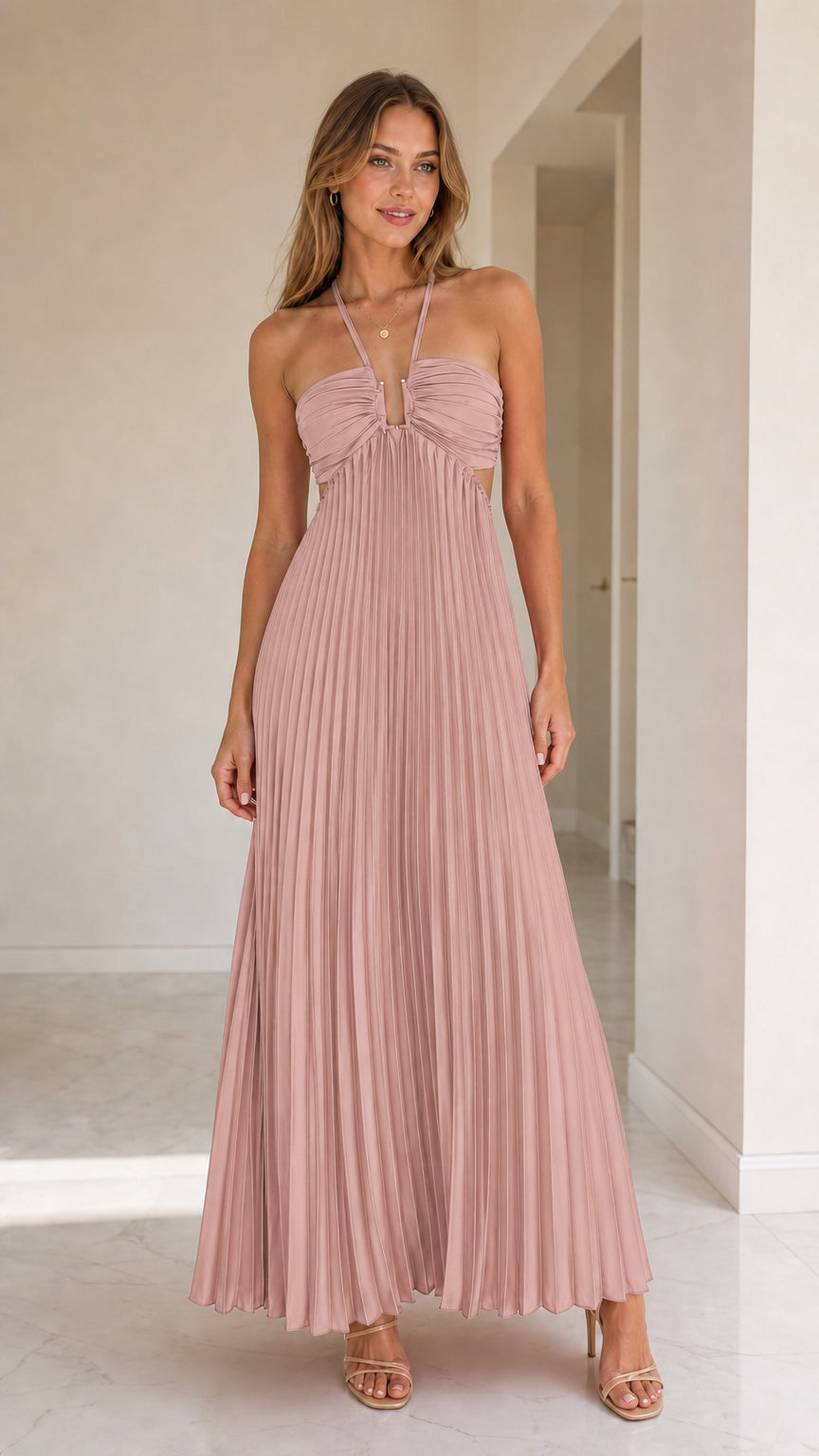 Model wearing dusty pink halter pleated maxi dress