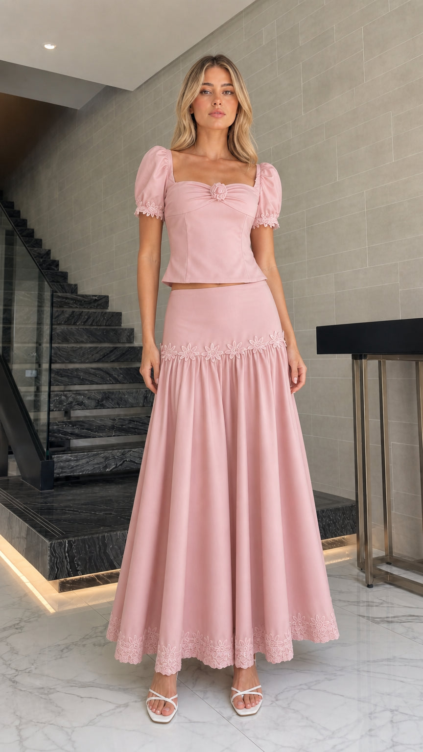 Model wearing pink puff sleeve crop top and maxi skirt set