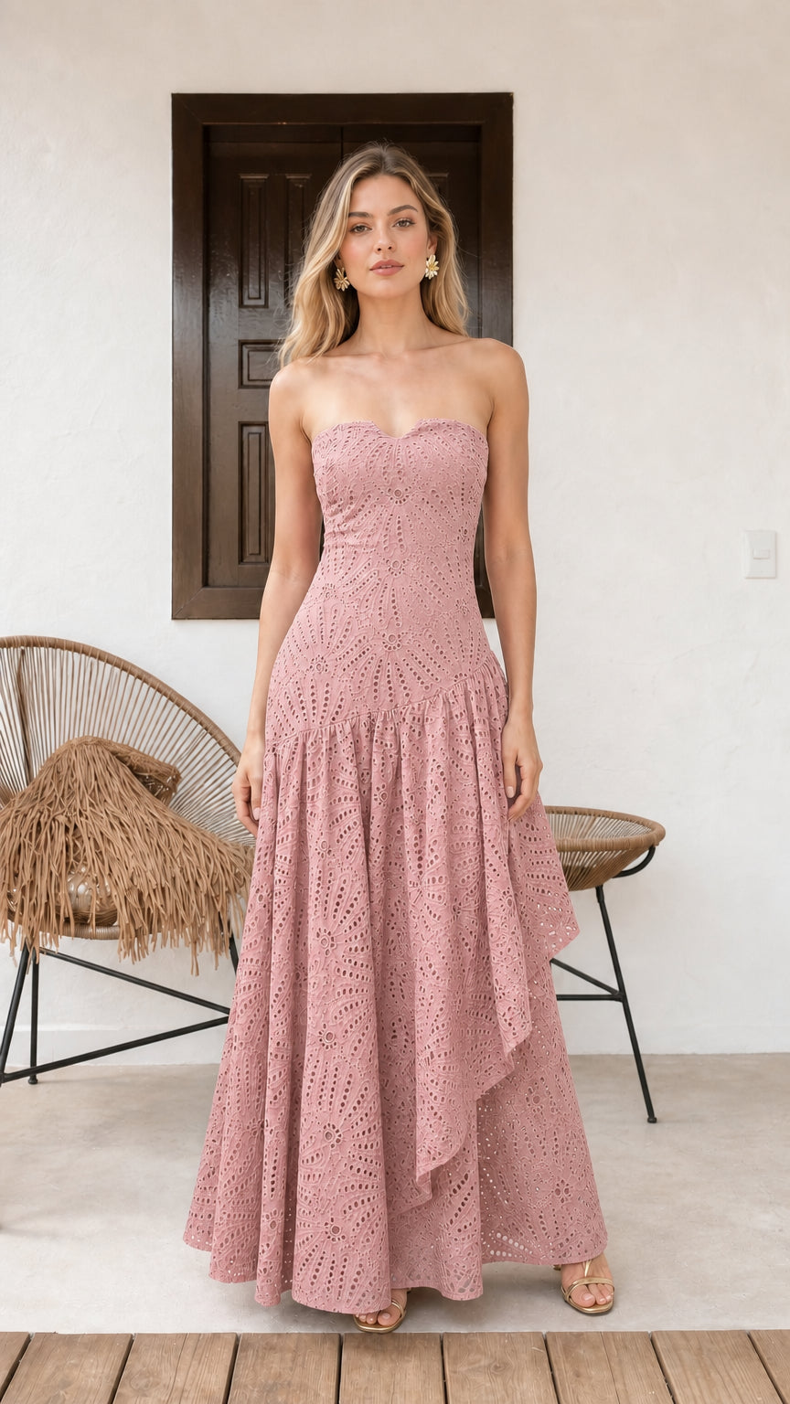Model wearing pink strapless eyelet maxi dress