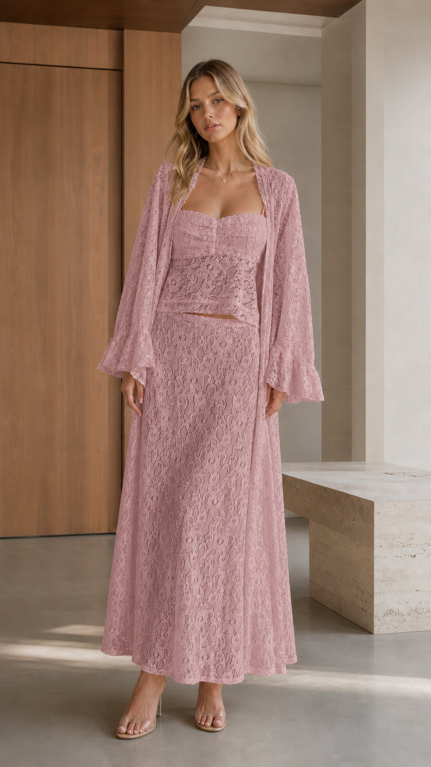Front view of woman wearing pink three-piece lace set