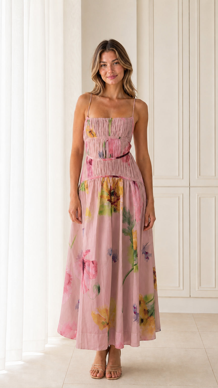 Front view of model wearing Pink floral smocked maxi dress