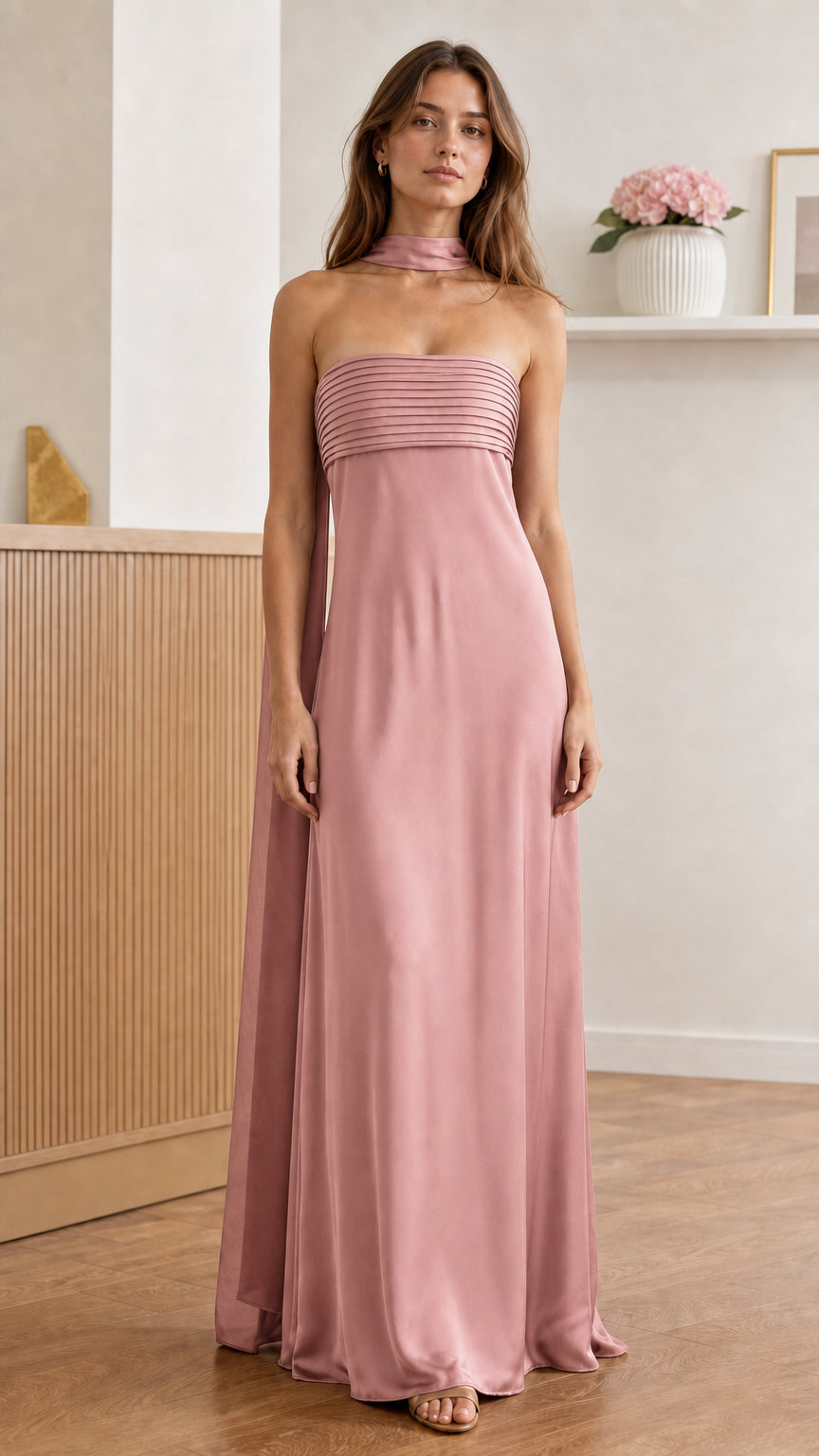 Front view of model wearing pink pleated strapless maxi dress