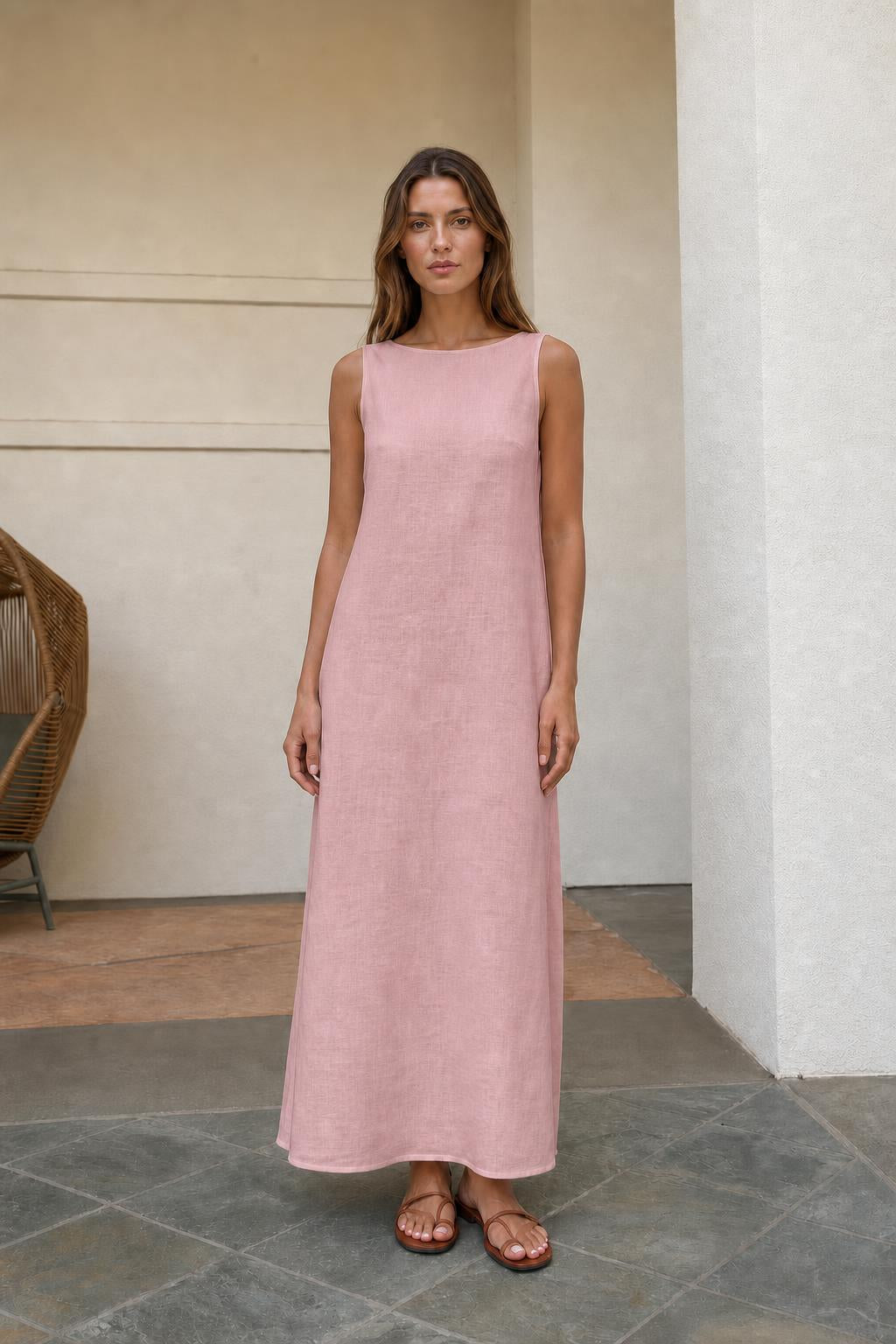 Woman wearing pink sleeveless maxi dress