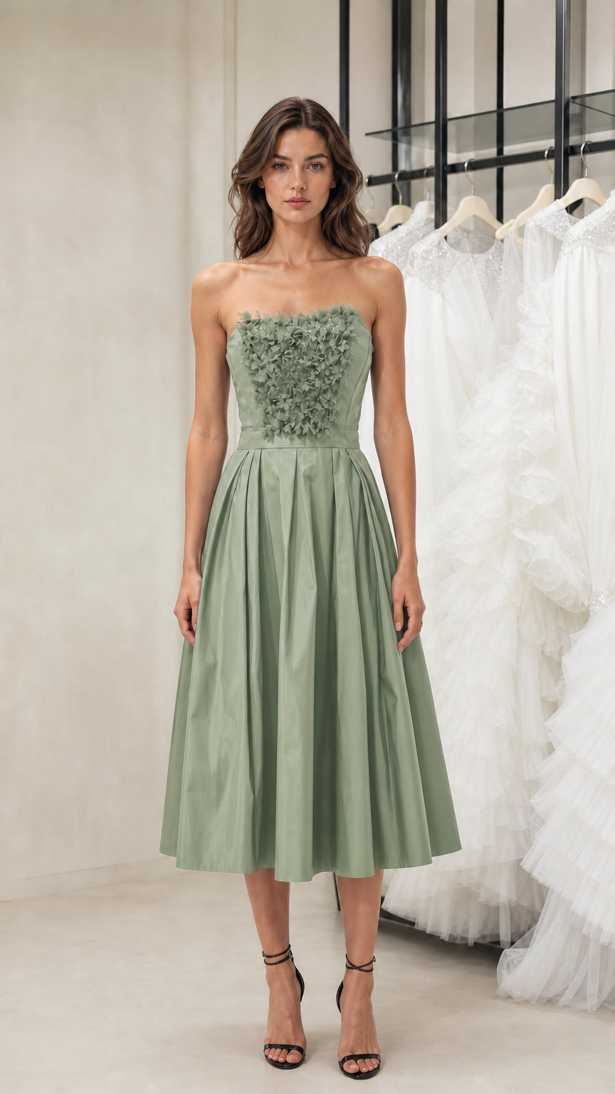 Front view of model wearing sage green strapless midi dress