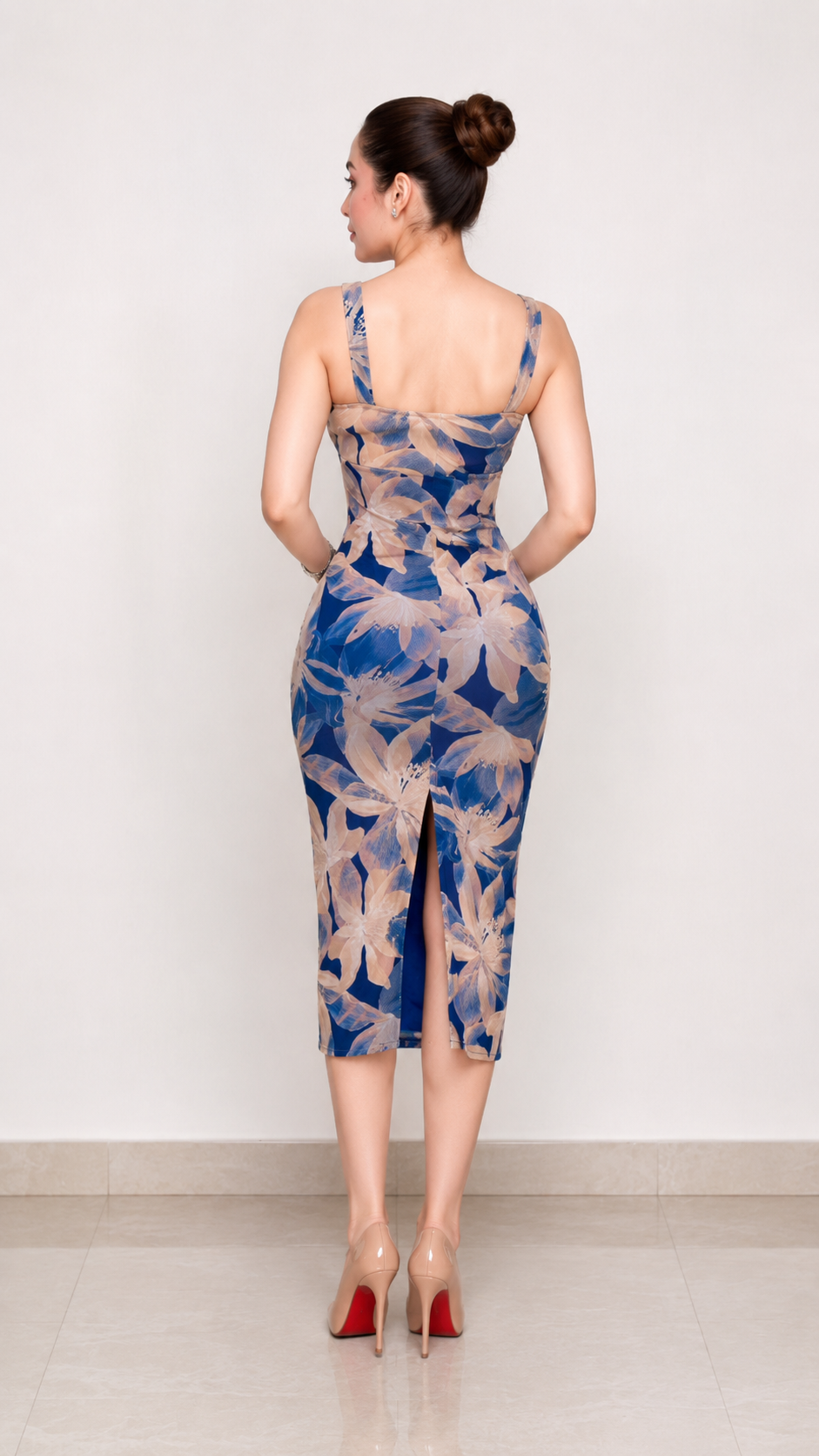 Back view of blue floral bodycon midi dress with back slit