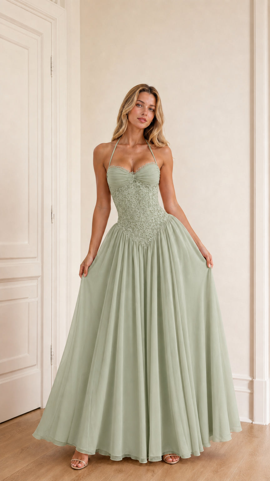 Model wearing sage green evening dress front view