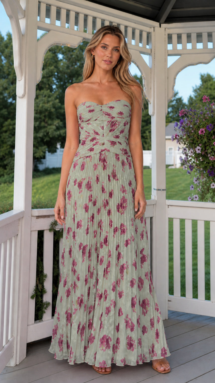 Front view of model wearing sage green strapless pleated floral maxi dress