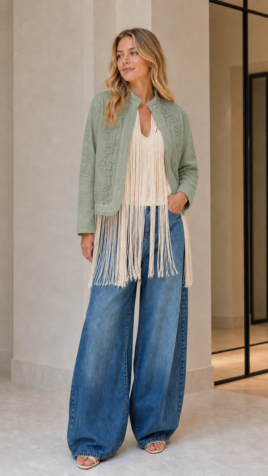 Model wearing sage embroidered fringe jacket