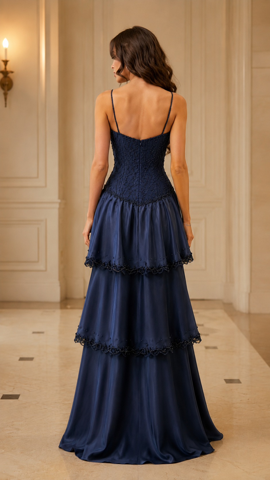 Back view of navy tiered maxi dress with slim straps and fitted bodice