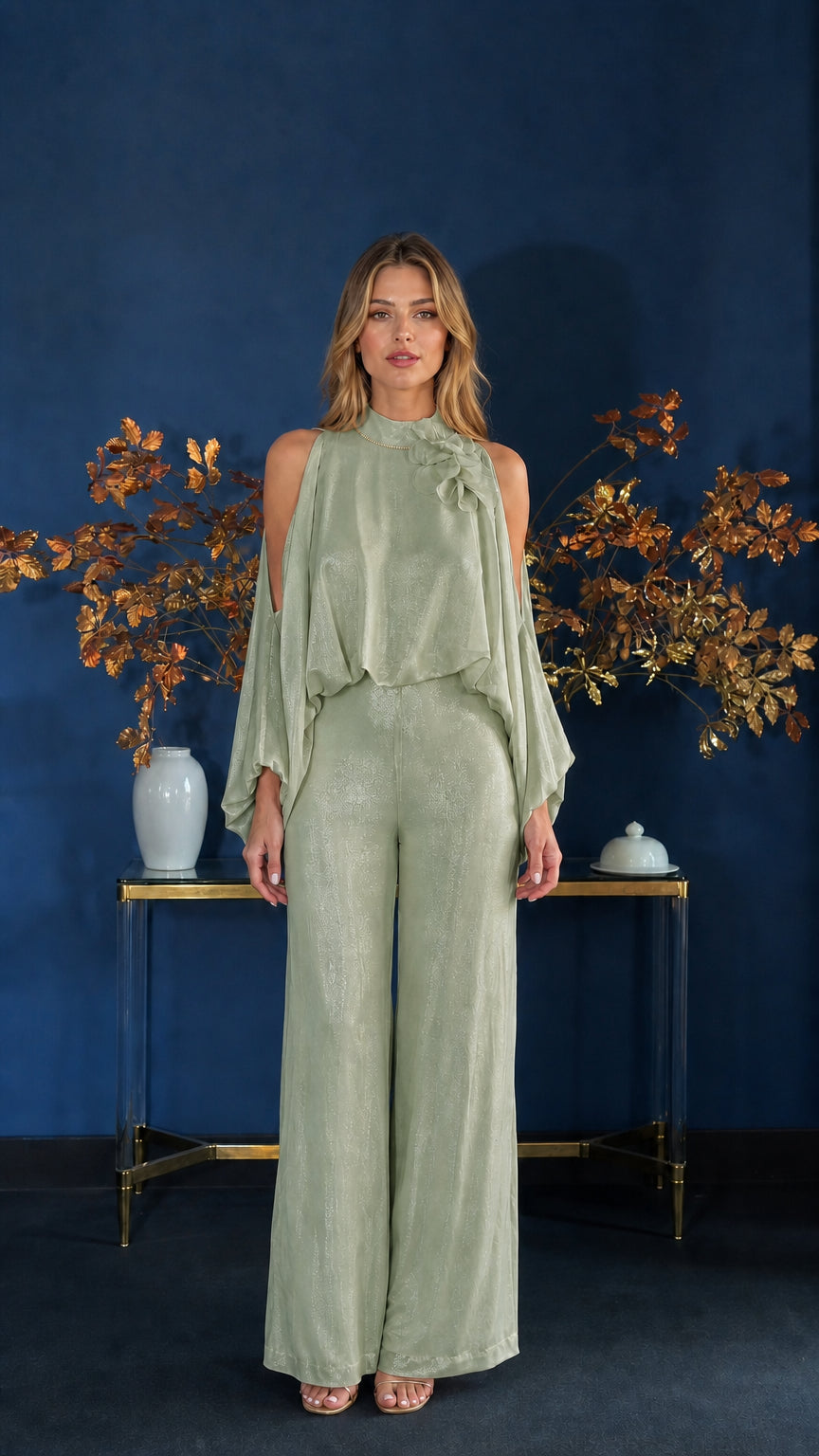 Front view of model wearing sage green cold-shoulder jumpsuit