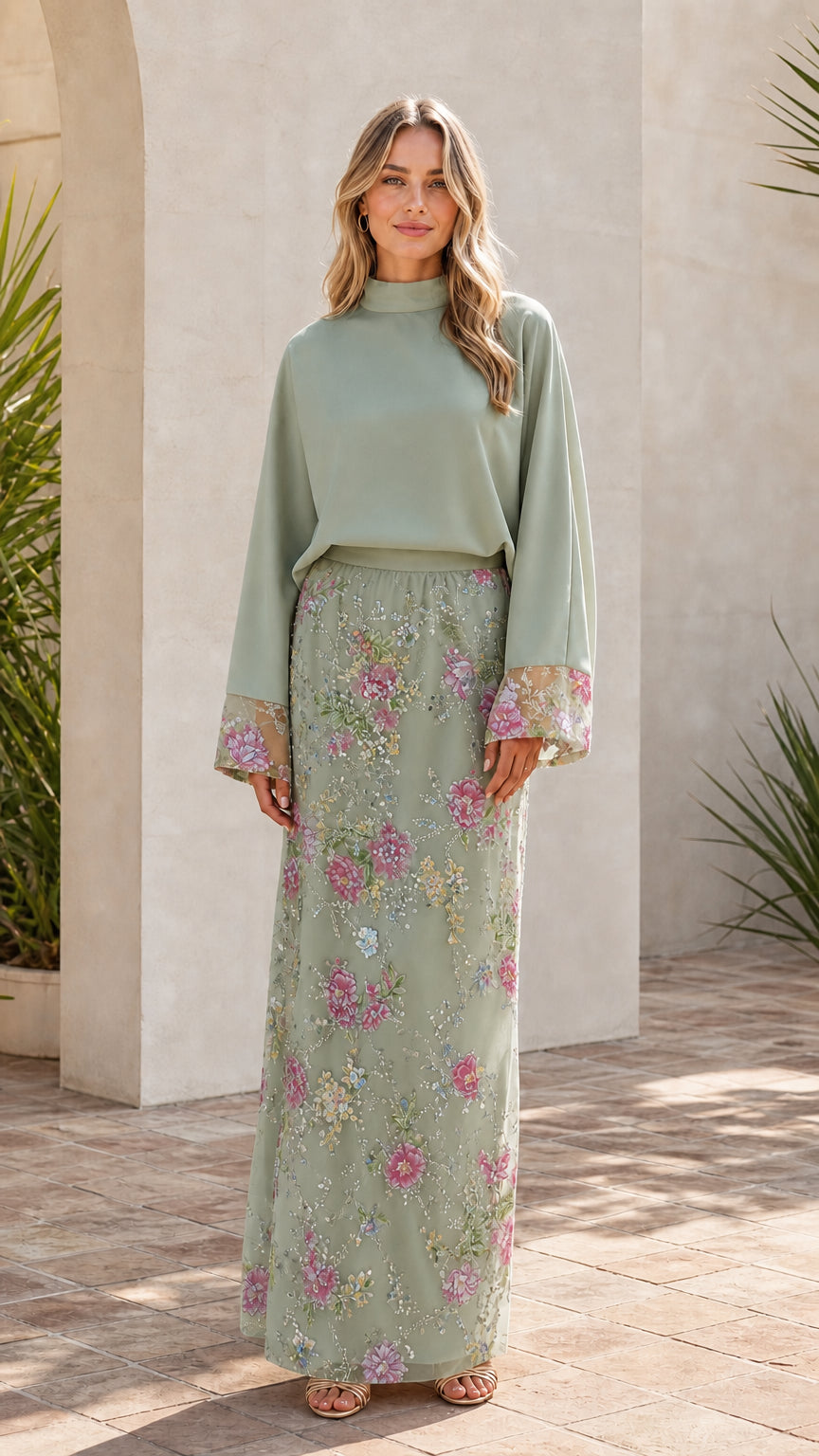 Model wearing sage green two-piece floral embroidered maxi set