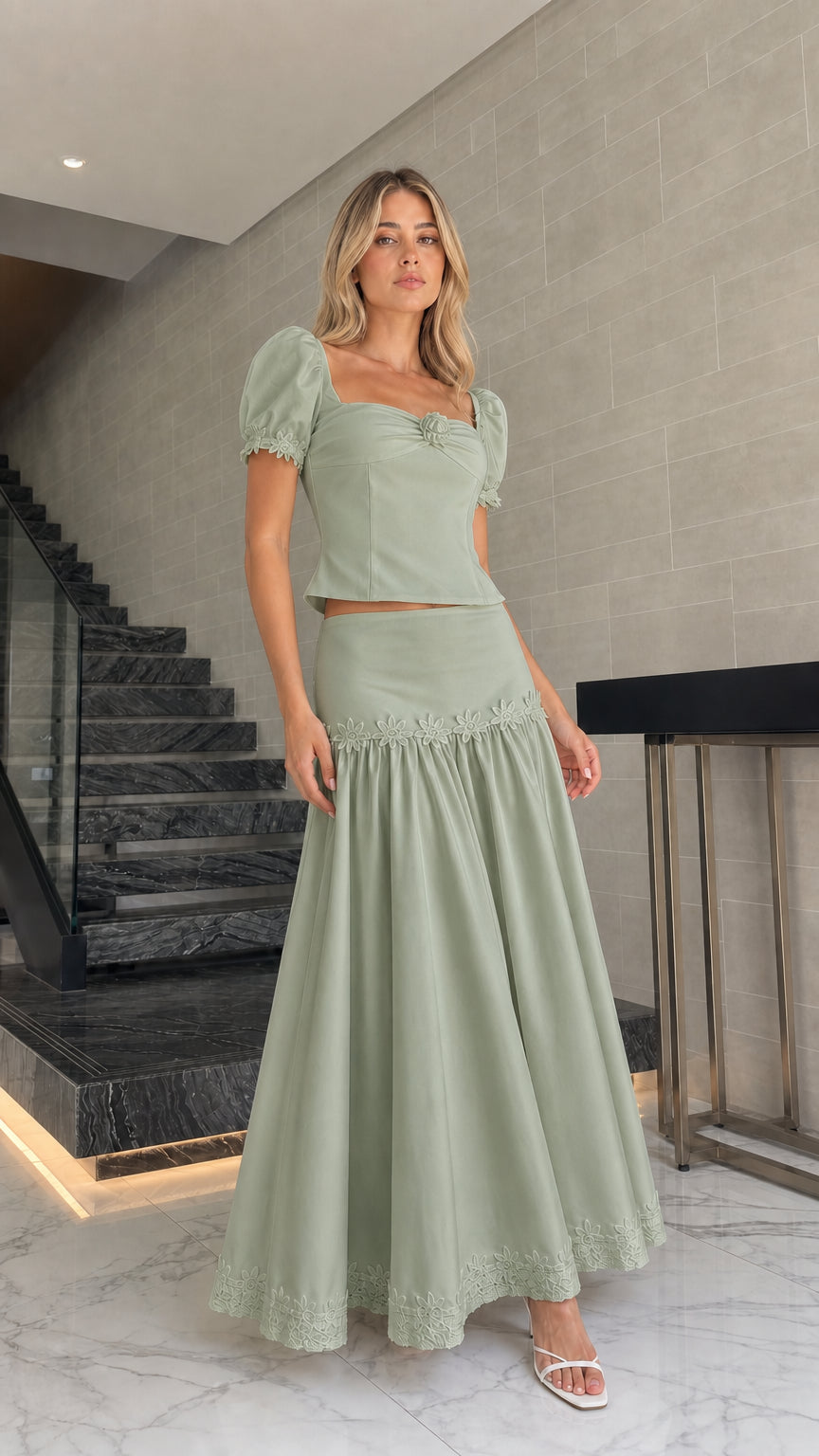 Model wearing sage green puff sleeve crop top and maxi skirt set