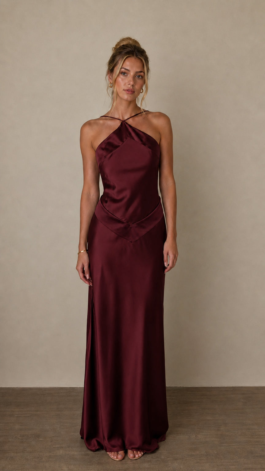 Front view of burgundy satin halter maxi dress on model
