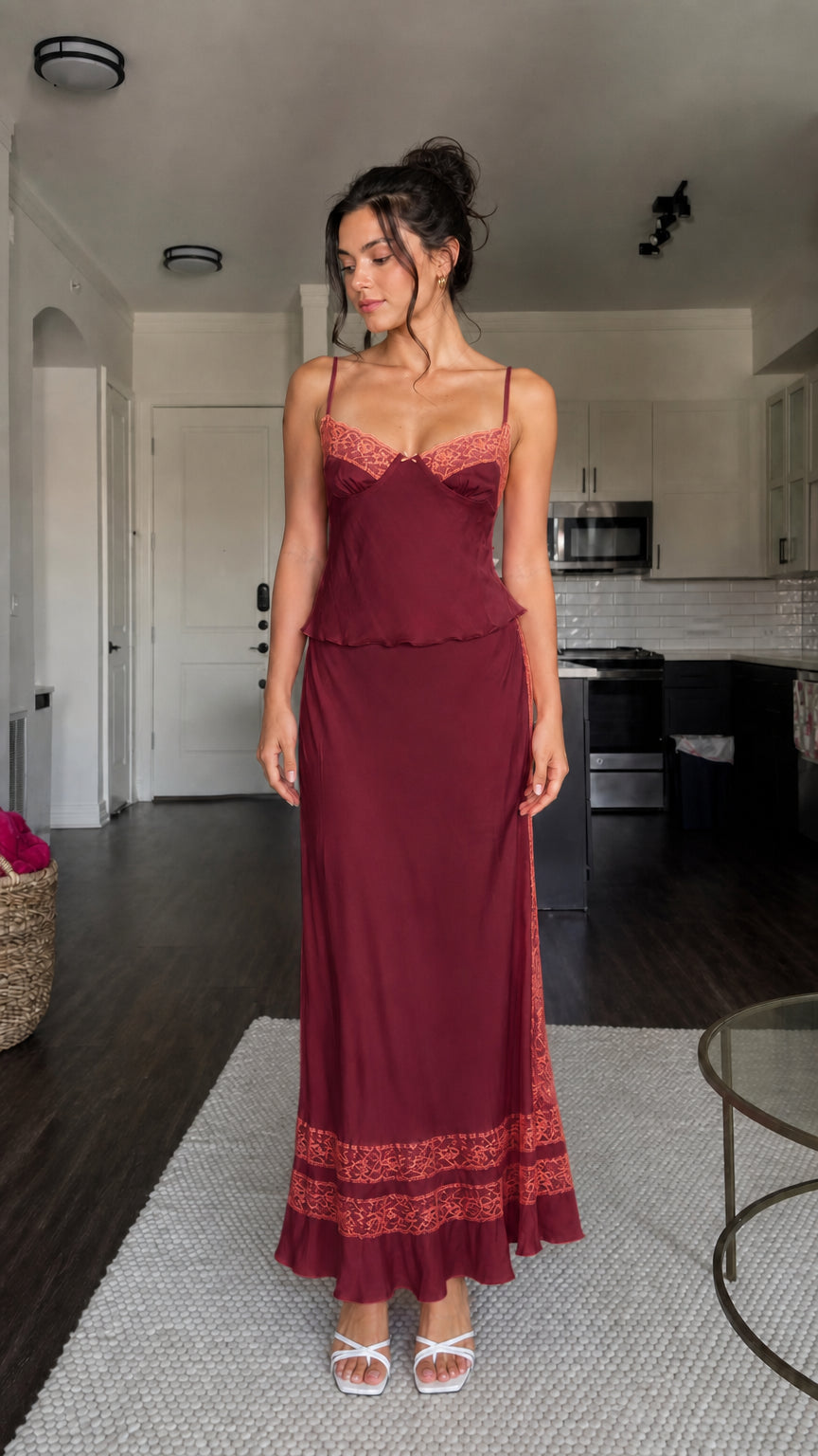 Model wearing burgundy two-piece satin set