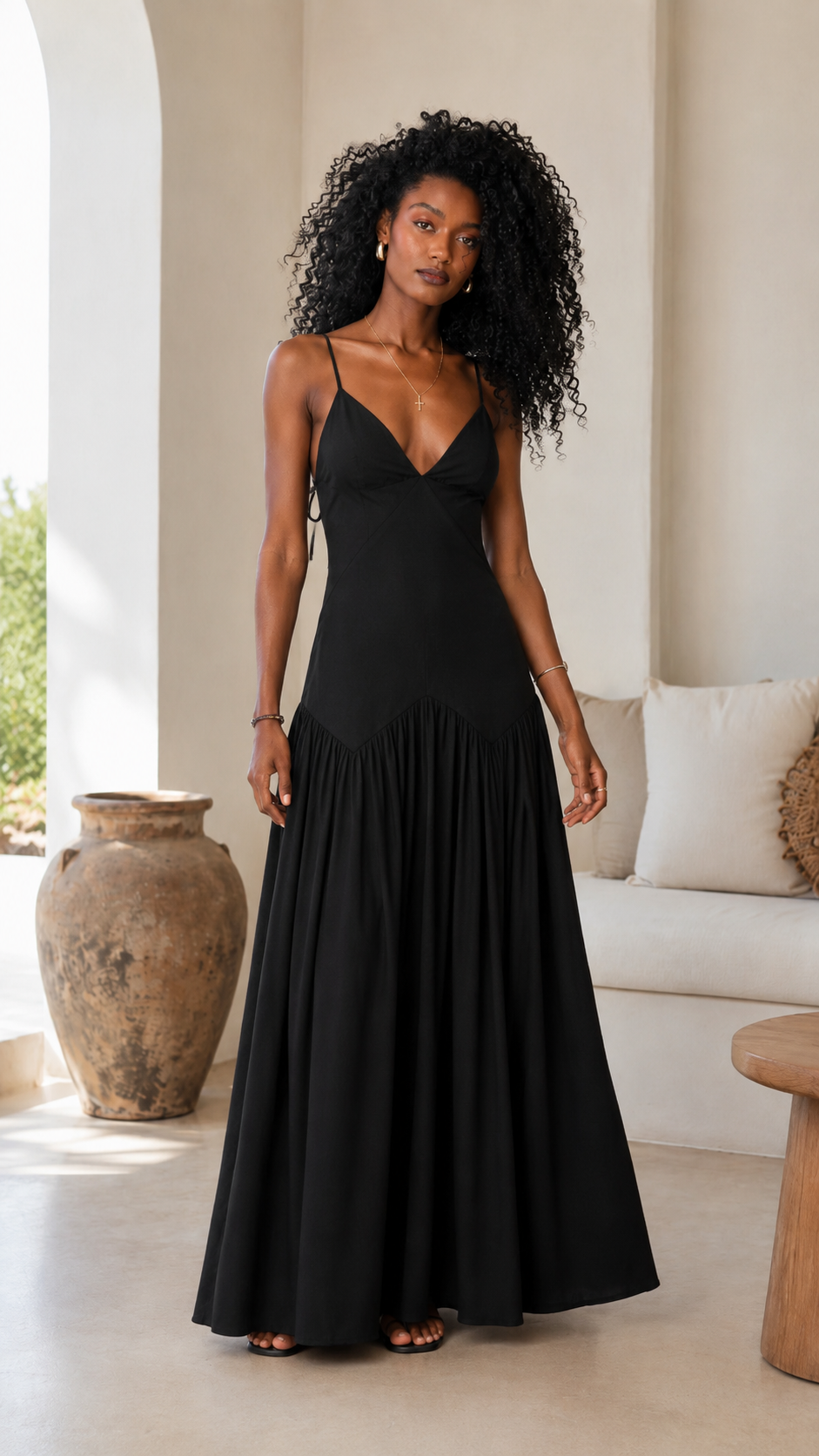 Black spaghetti strap maxi dress with deep V neckline and full-length hem