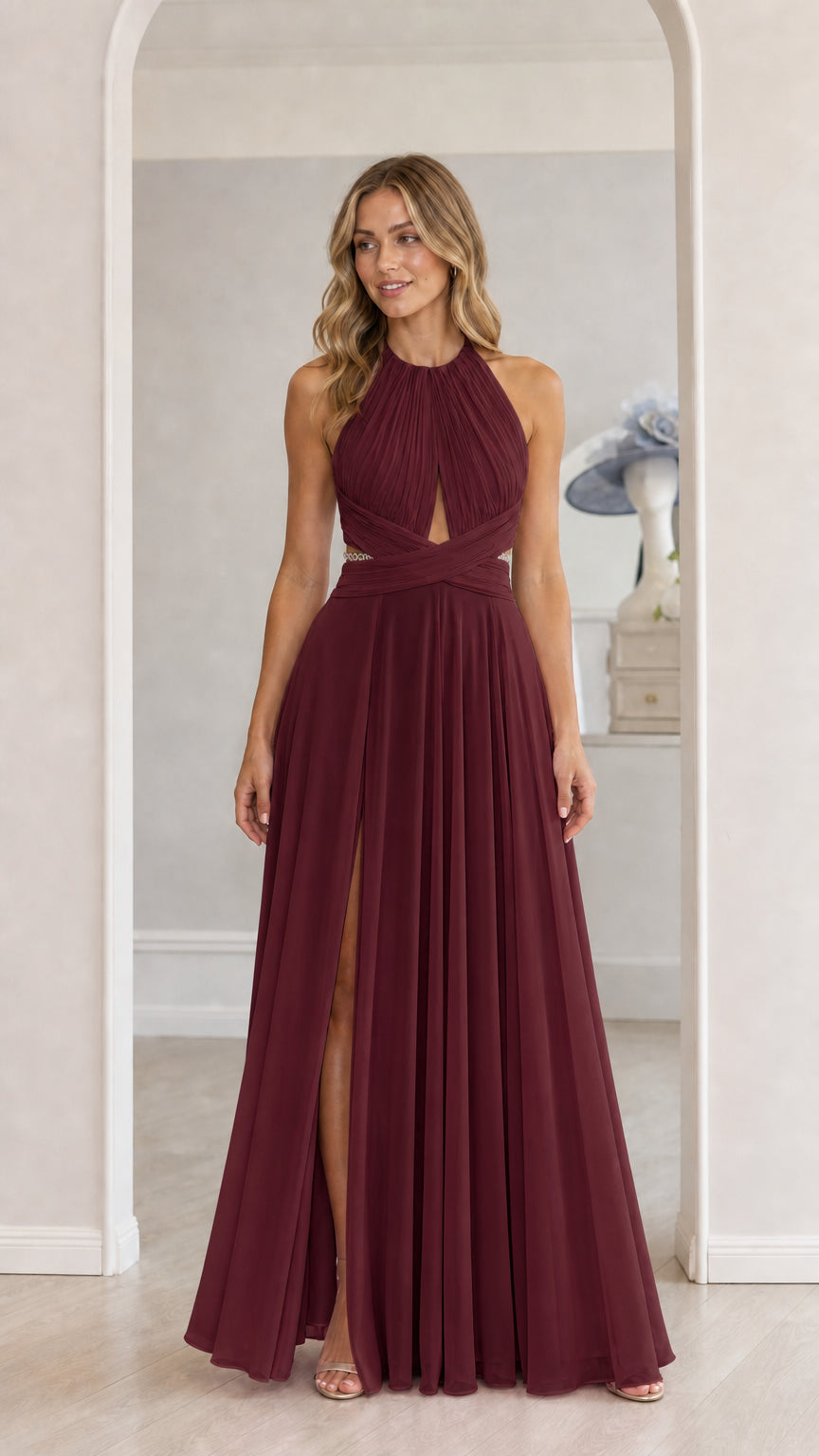 Model wearing burgundy chiffon halter maxi dress with front slit