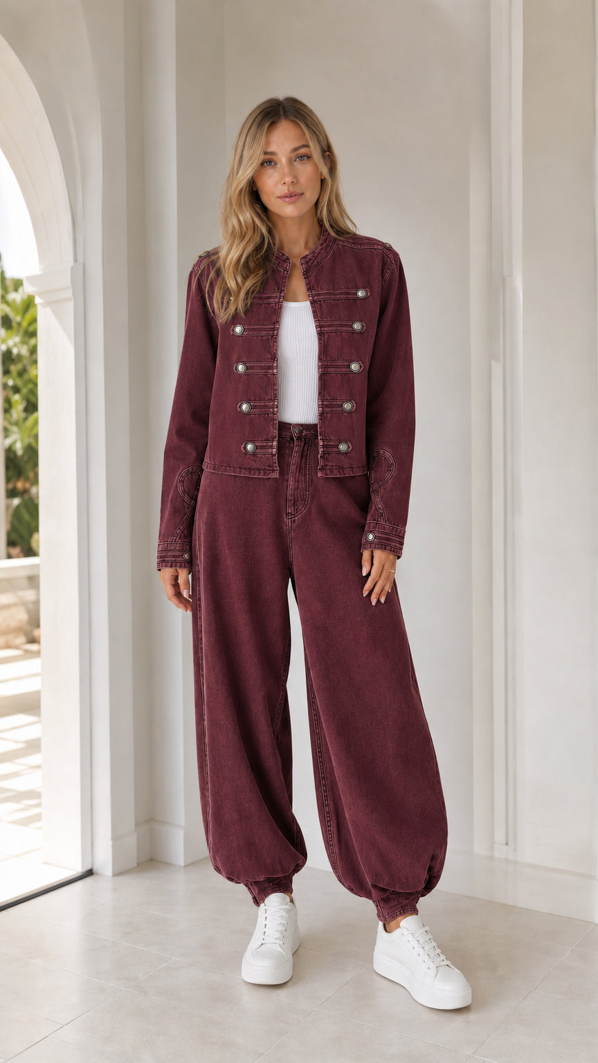 Front full view of woman wearing burgundy utility jacket and matching pants