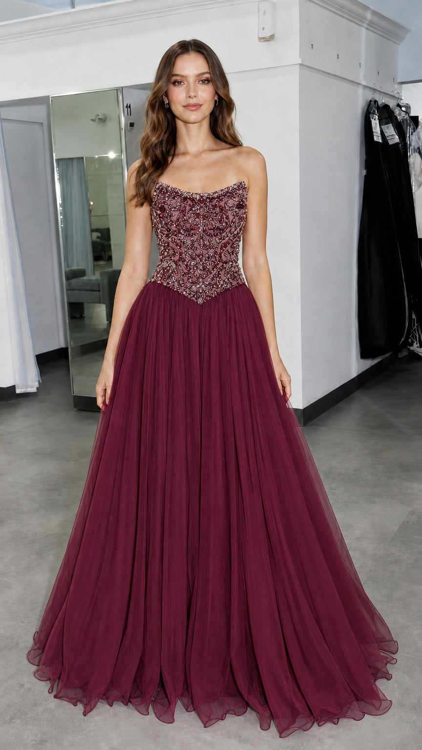 Front view of model wearing burgundy formal gown