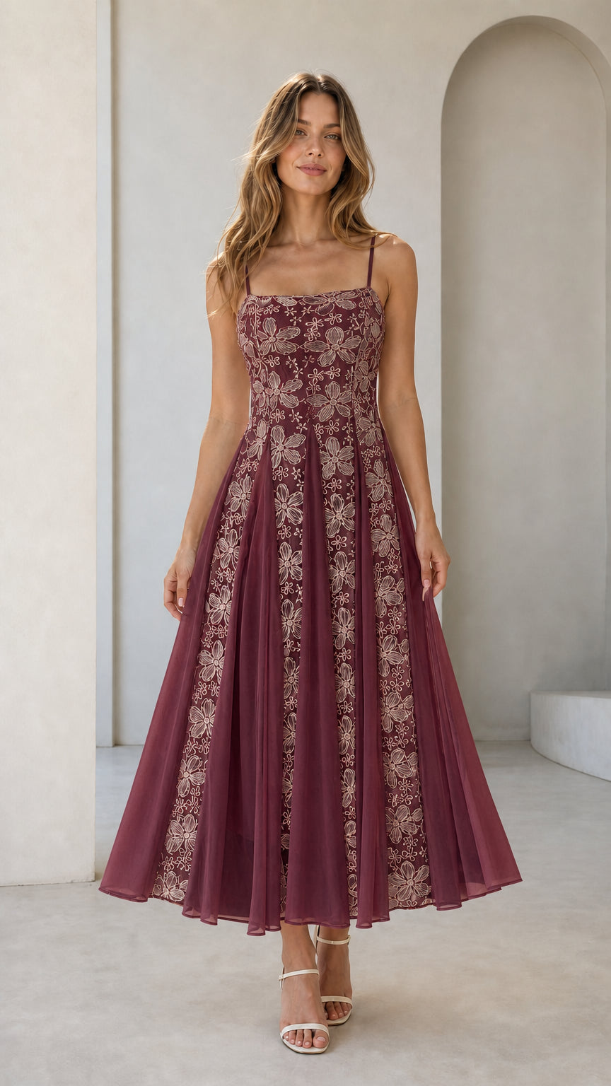 Front view of burgundy floral embroidered midi dress on model