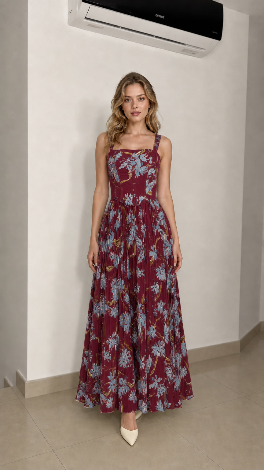 Model wearing burgundy floral maxi dress