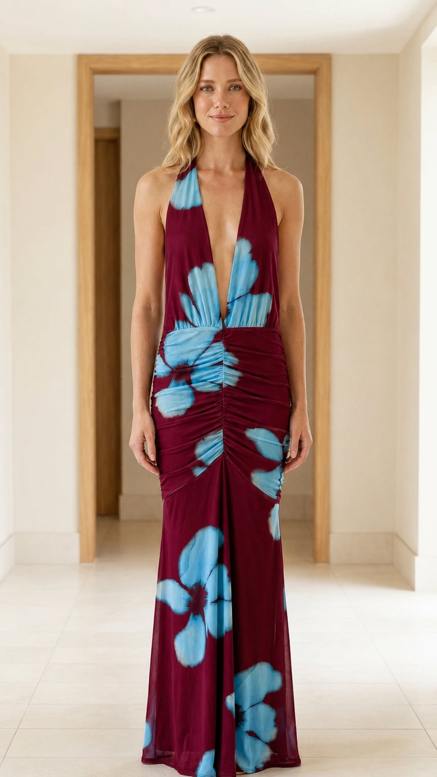Front view of model wearing burgundy halter floral maxi dress