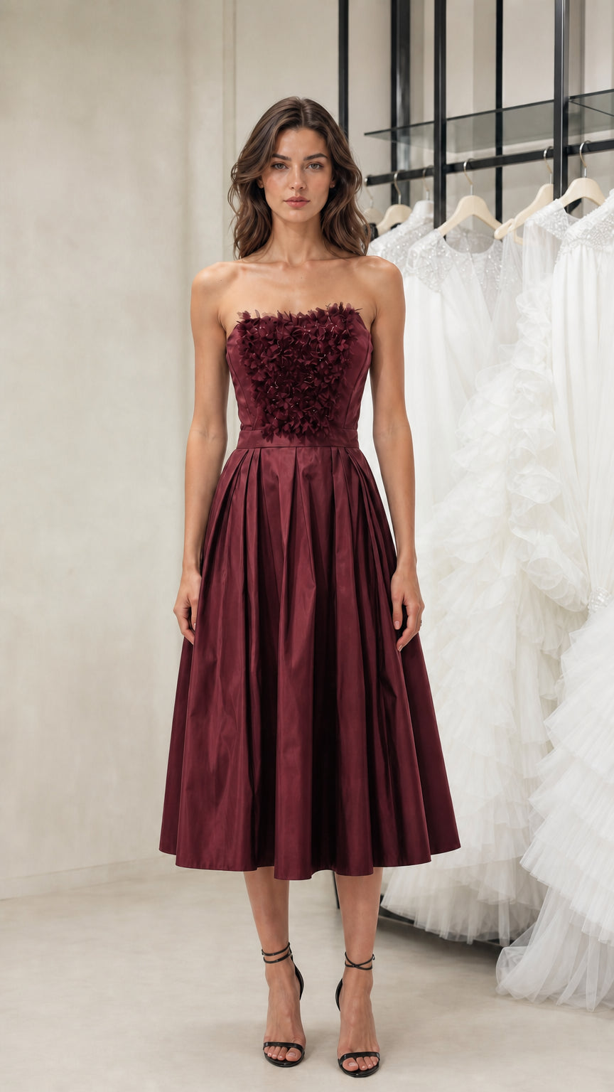 Front view of model wearing burgundy strapless midi dress