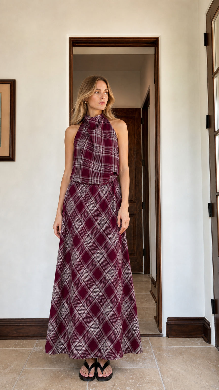 Woman wearing burgundy plaid halter top and matching maxi skirt