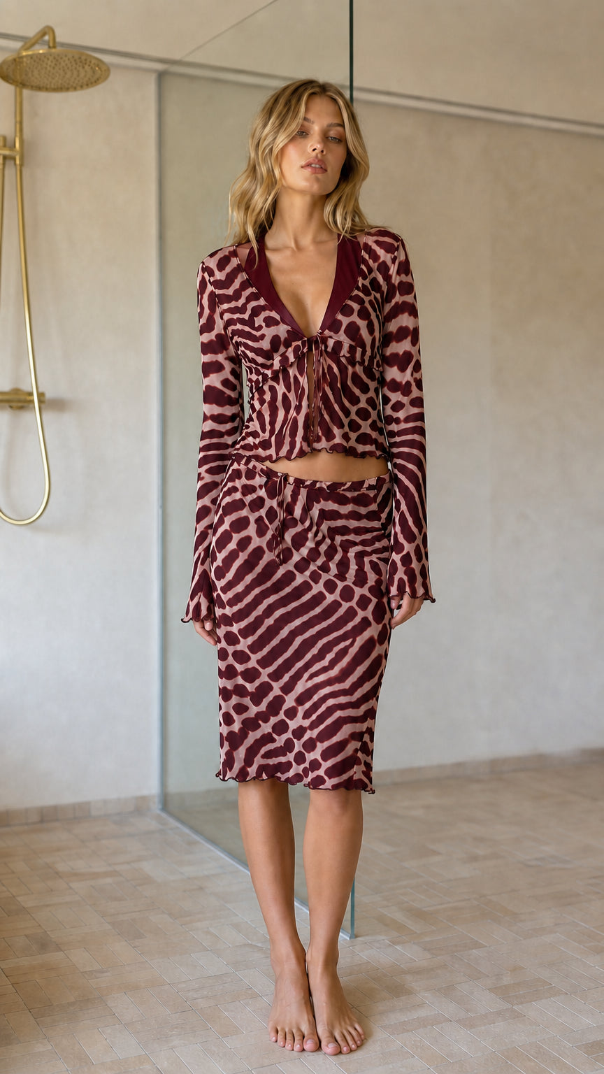 Front view of burgundy animal print two-piece outfit