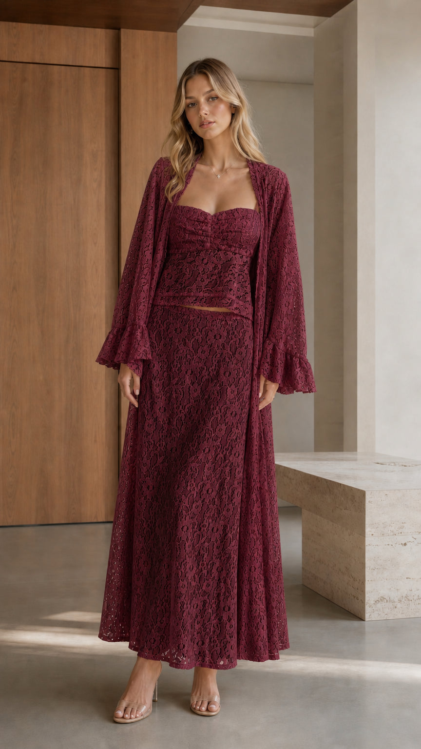 Front view of woman wearing burgundy three-piece lace set