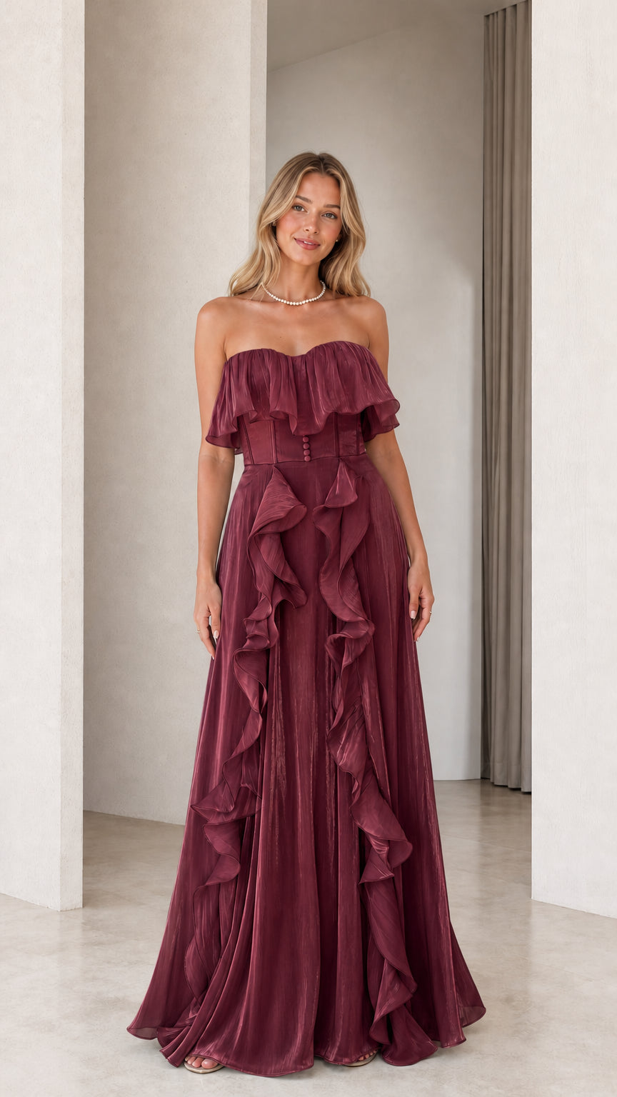 Front view of burgundy strapless ruffled evening dress