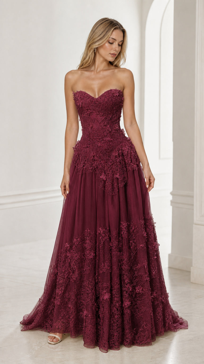 Front view of burgundy strapless floral applique ball gown
