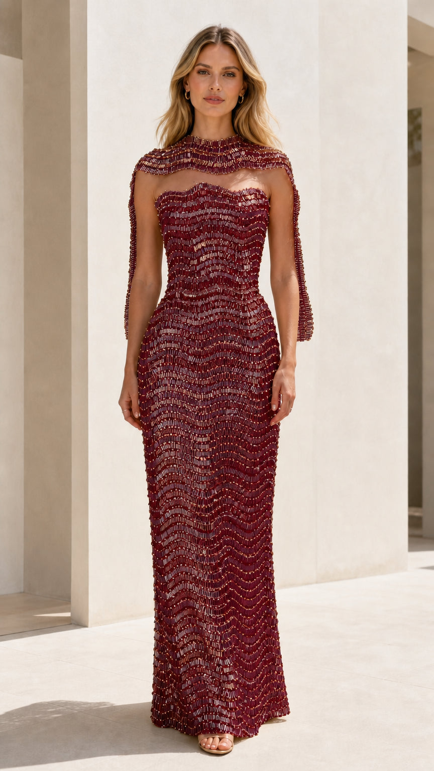 Front view of burgundy sequin strapless gown with matching shrug
