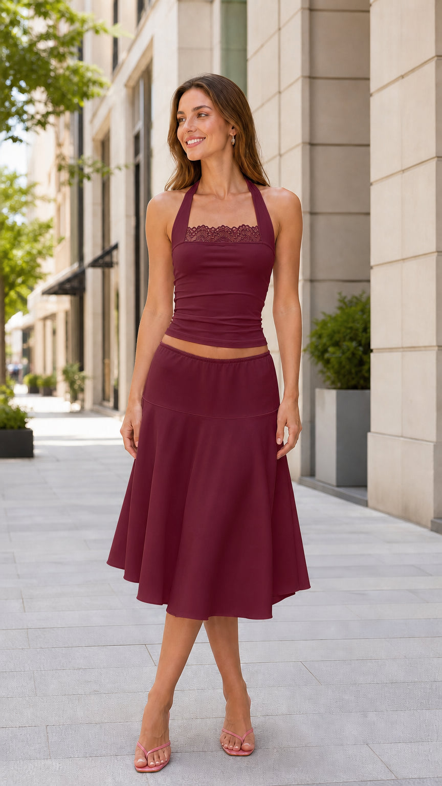 Model wearing the burgundy halter top and midi skirt set