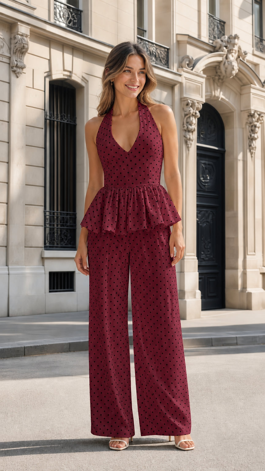 Front view of burgundy polka dot halter peplum jumpsuit