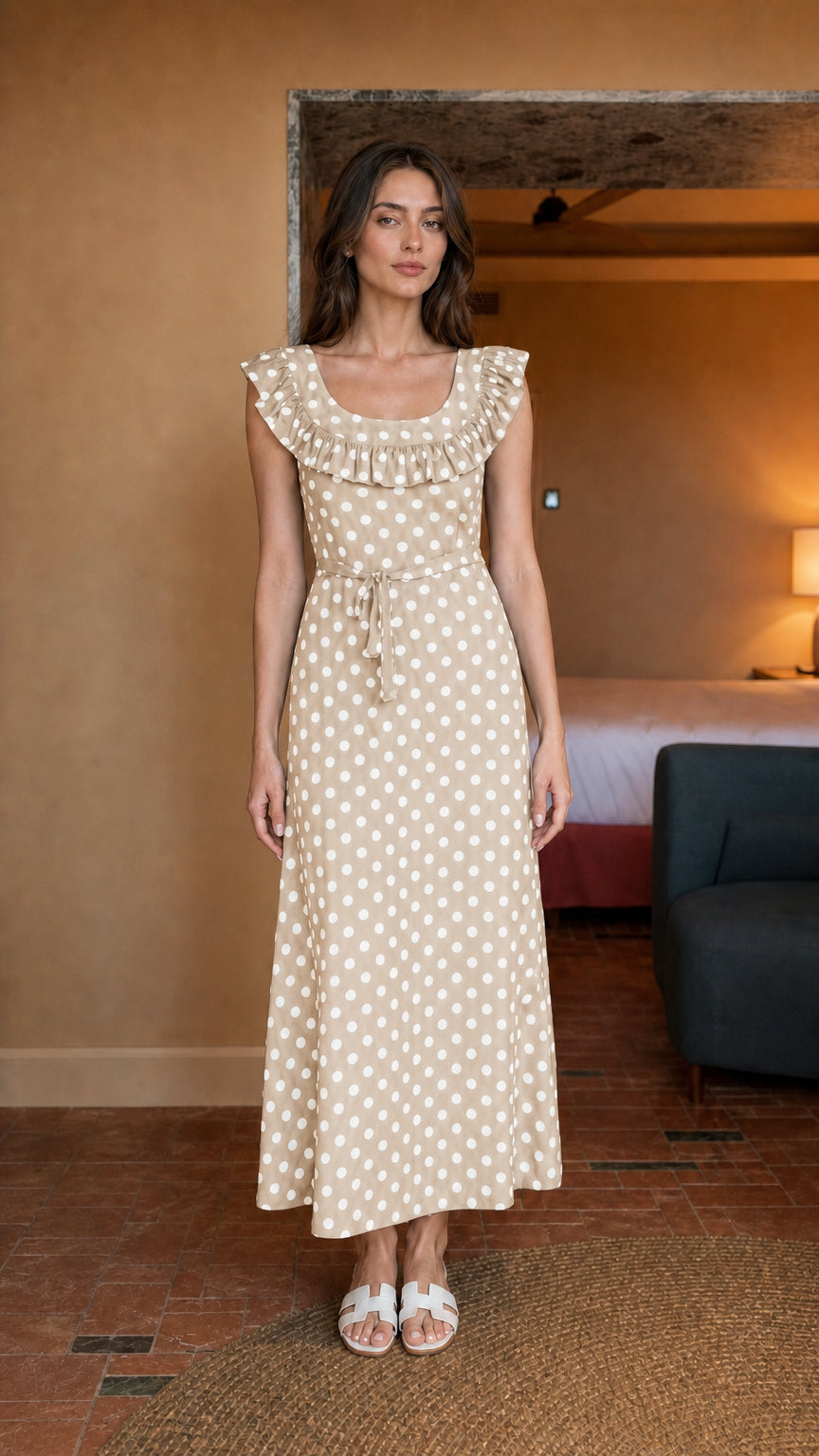 Woman wearing beige polka dot midi dress