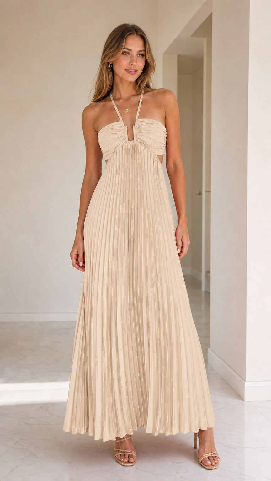 Model wearing beige halter pleated maxi dress