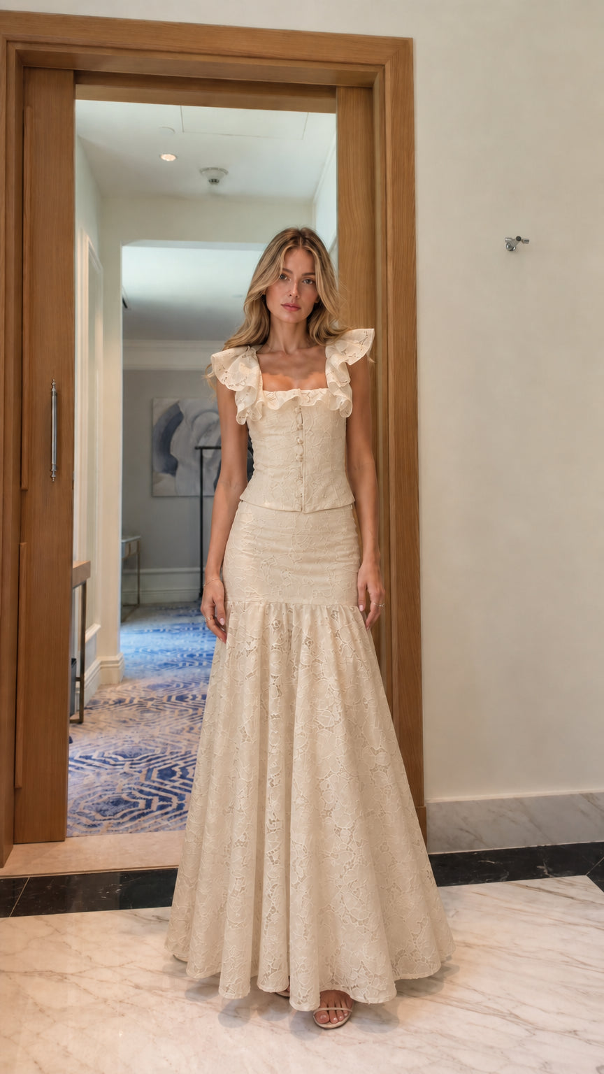 Model wearing cream lace crop top and mermaid maxi skirt set